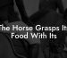 The Horse Grasps Its Food With Its