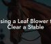 Using a Leaf Blower to Clear a Stable